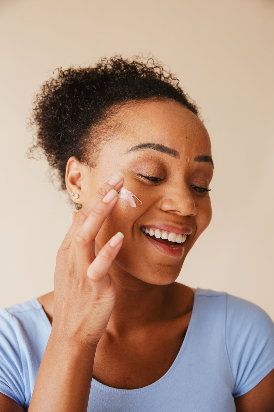 Smiling woman during a relaxing facial treatment