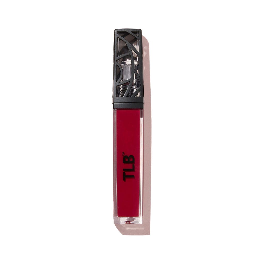 Deep red liquid lipstick in a decorative black-cased tube