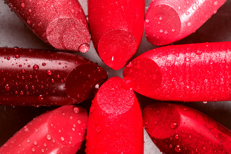 Close-up of red lipstick bullets in different shades and finishes
