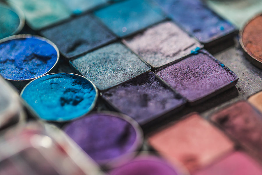 Vibrant multicolor eyeshadow swatches blended on a surface