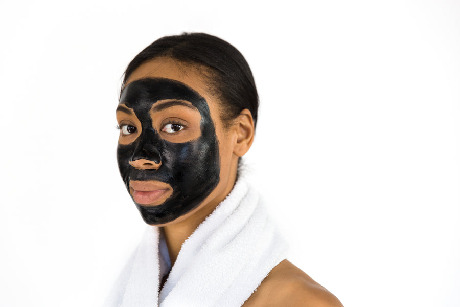 Woman relaxing while wearing a purifying face mask